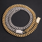 Gold and silver Cuban link chain necklaces with box clasps on a black background
