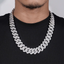 iced out Cuban link chain necklace with large silver links on a person wearing black shirt