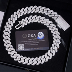 Iced out Cuban link chain necklace with sparkling stones in a black jewelry box