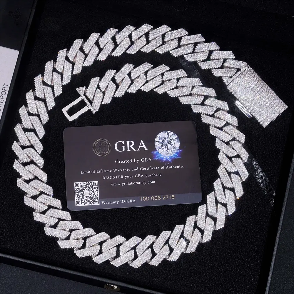 Iced out Cuban link chain necklace with sparkling stones in a black jewelry box