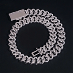 Silver Cuban link chain bracelet with box clasp on black background, luxury jewelry