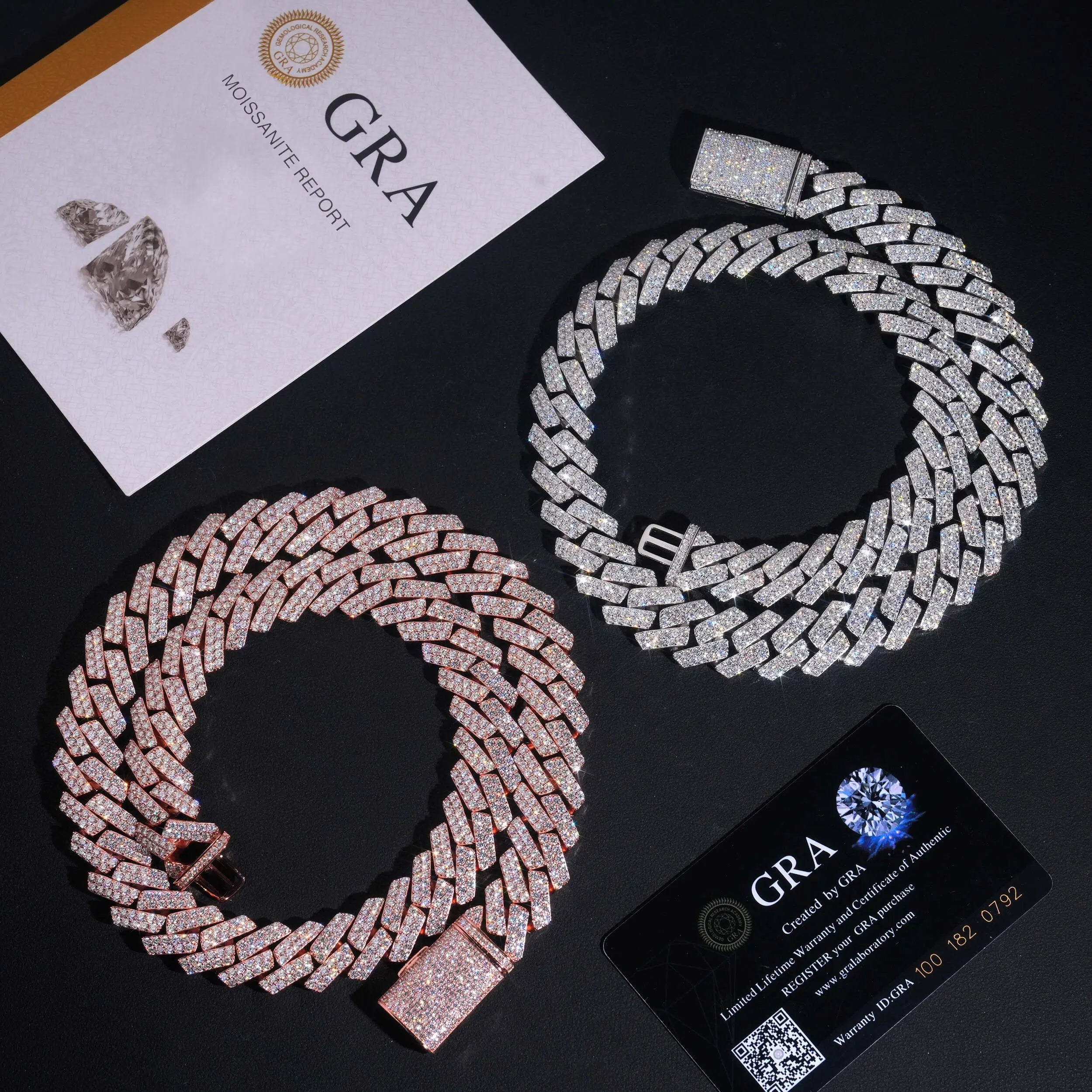 Two iced out Cuban link chains, one rose gold and one silver, with moissanite certificate cards.