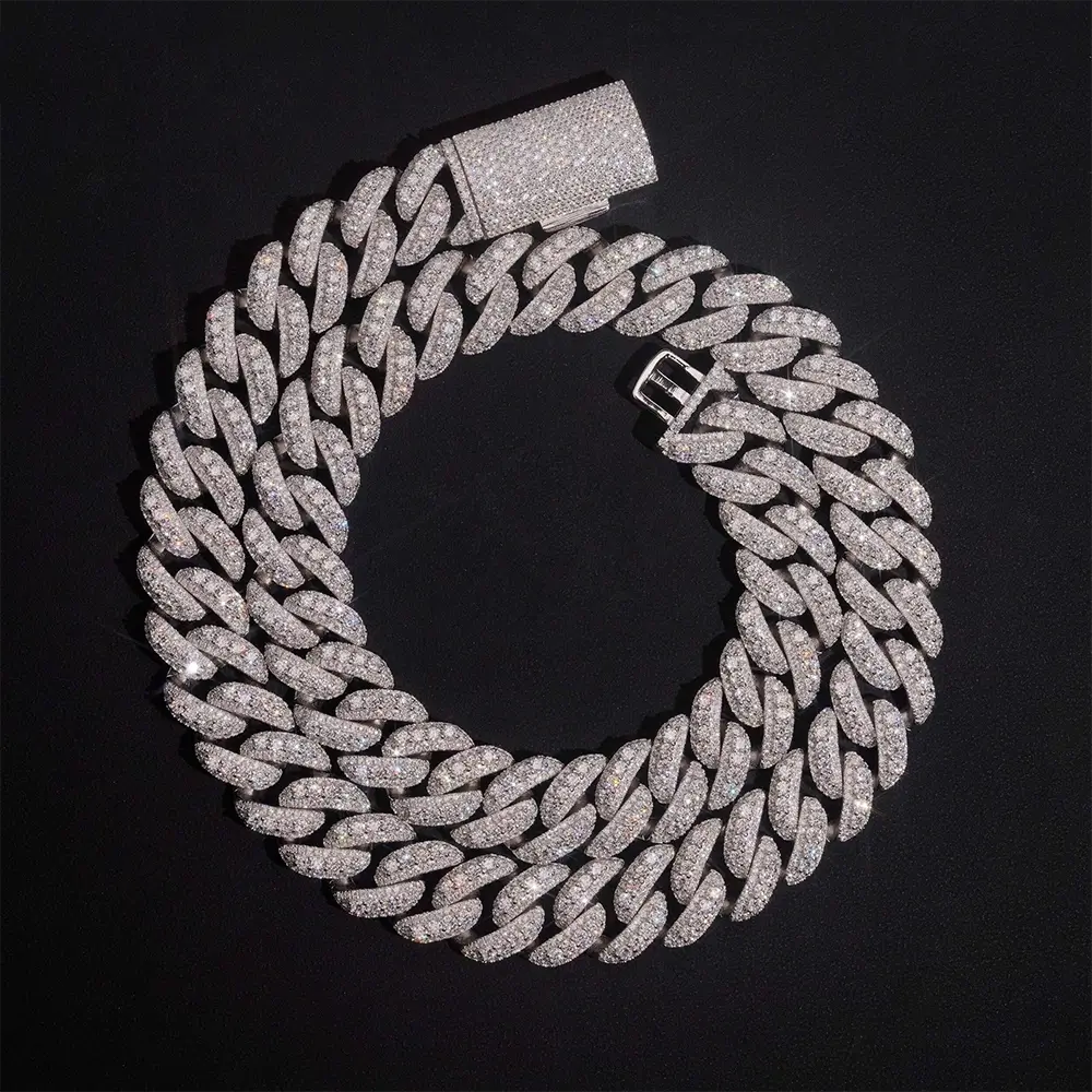 Iced out Cuban link chain necklace with sparkling stones on black background