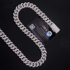 Iced out Cuban link chain necklace with diamonds on black background and authenticity card