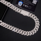 Iced out Cuban link chain necklace with diamond stones on black background