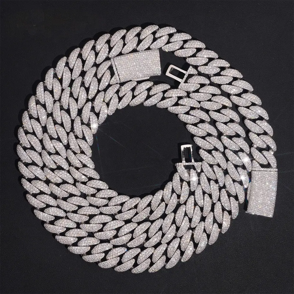 Iced out Cuban link chain with diamond pavé on black background, hip hop jewelry style