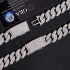 close-up of iced-out Cuban link chain with clasp, pavé stones on black background