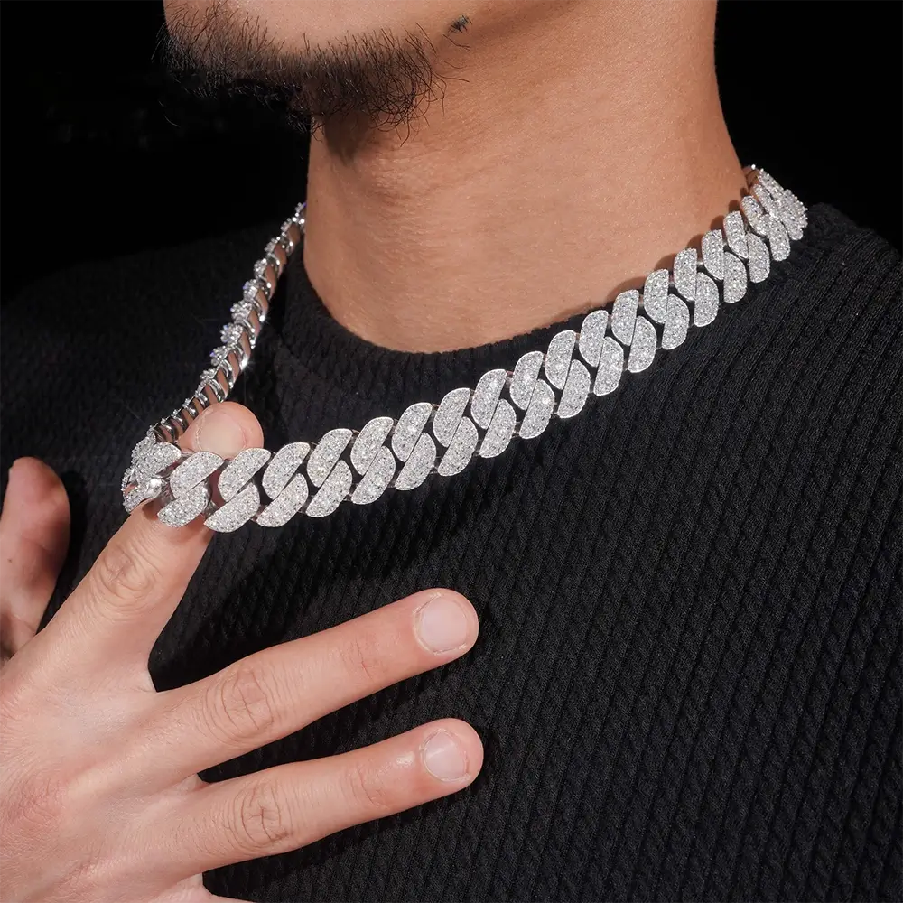 Close-up of man wearing a thick iced out Cuban link chain necklace with diamonds Secondary image