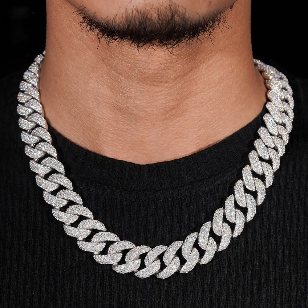 Close-up of man wearing a thick iced out Cuban link chain necklace Main image