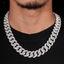 Close-up of man wearing a thick iced out Cuban link chain necklace