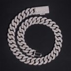 Iced out Cuban link chain necklace with sparkling crystals on black background