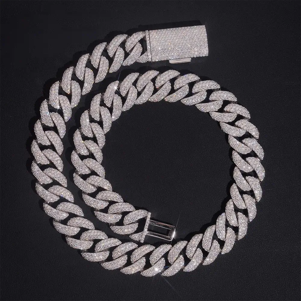 Iced out Cuban link chain necklace with sparkling crystals on black background