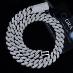 Iced out Cuban link chain necklace with sparkling crystals on black background