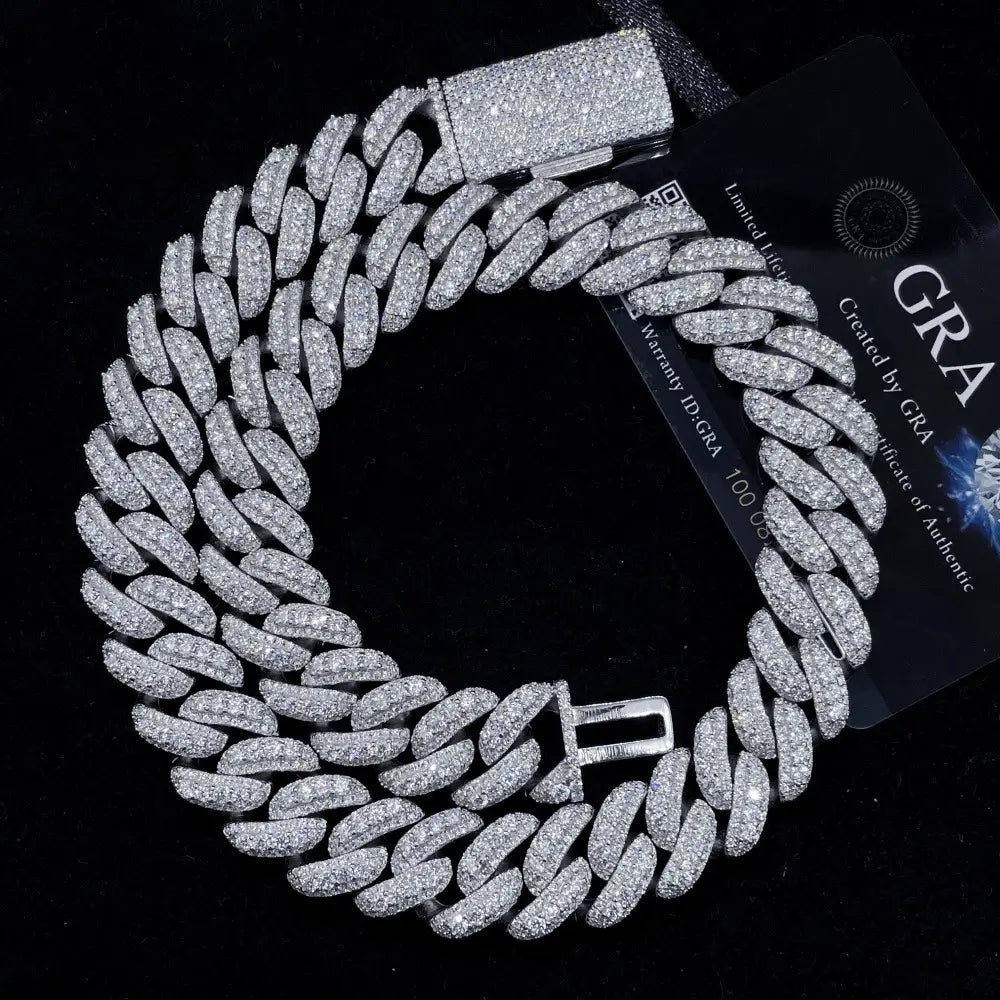 Iced out Cuban link chain necklace with sparkling crystals on black background