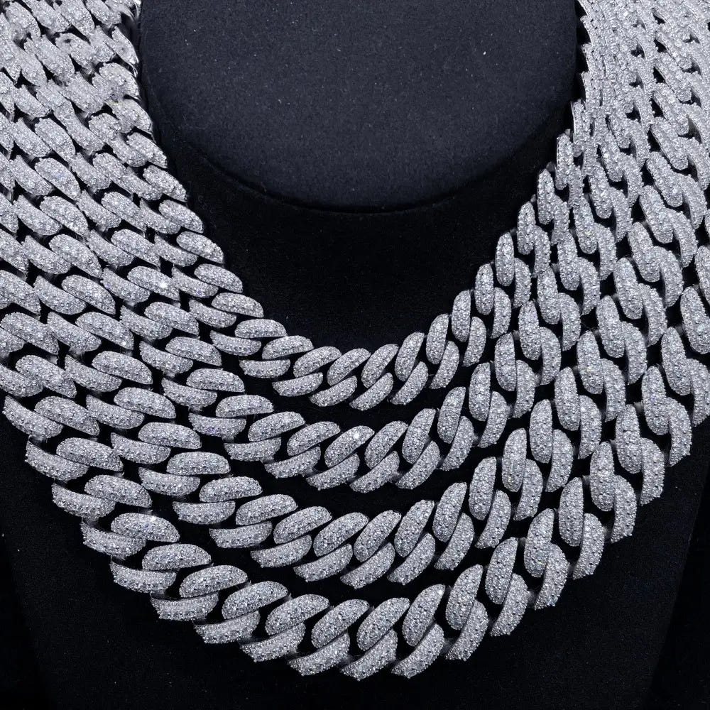 Layered iced out Cuban link chain necklaces with sparkling stones on black display Secondary image