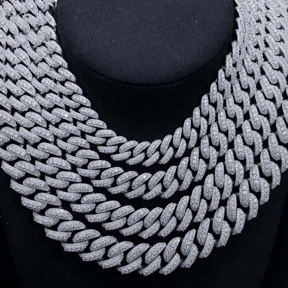 Layered iced out Cuban link chain necklaces with sparkling stones on black display Secondary image