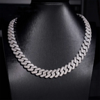 Diamond Cuban link chain necklace on black display, luxury jewelry, men's fashion accessory