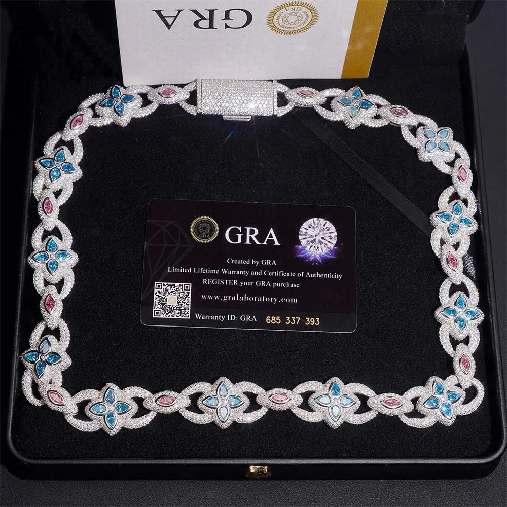 Luxury diamond necklace with blue and pink gemstone accents in black jewelry box