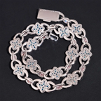 Silver chain necklace with blue gemstone floral links on black background