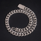 Shiny silver Cuban link chain necklace with box clasp on black background