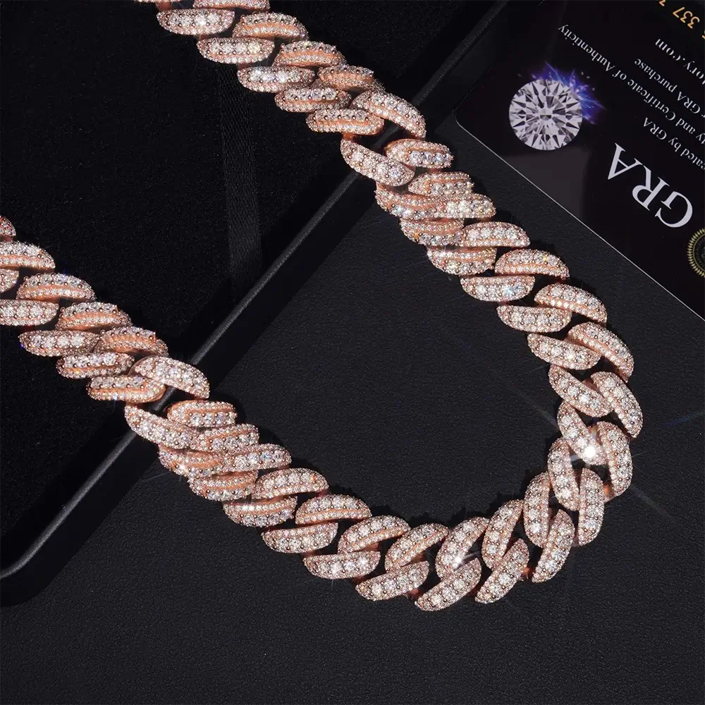 Rose gold Cuban link chain necklace encrusted with sparkling diamonds on a black background Secondary image