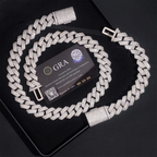 Iced out Cuban link chain necklace with diamond finish on black background and authenticity card.