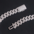 iced out Cuban link bracelet with clear stones on black background