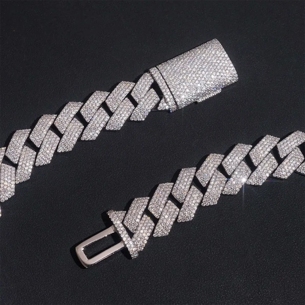 iced out Cuban link bracelet with clear stones on black background