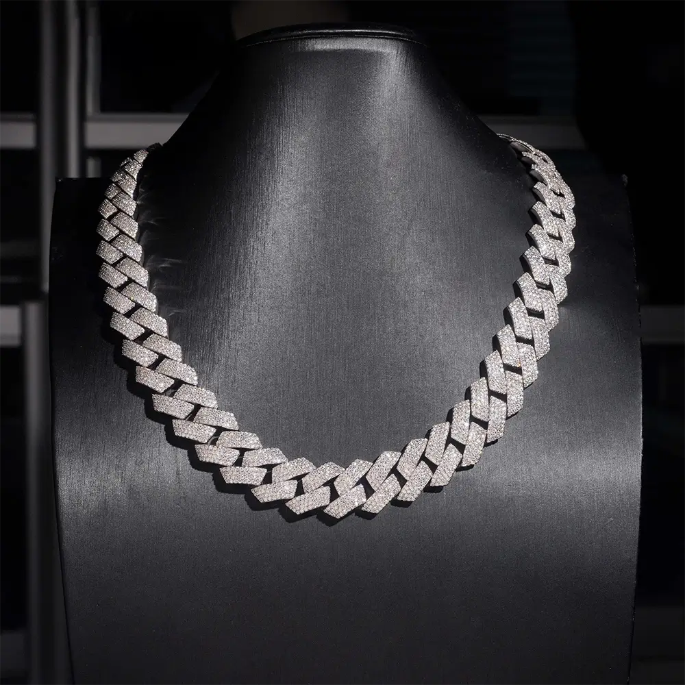 Iced out Cuban link chain necklace with clear stones on a black display bust Secondary image