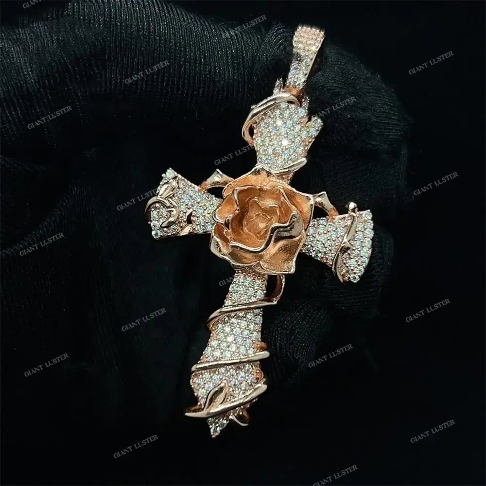 Diamond cross pendant with rose gold flower and crystal accents held by gloved hand